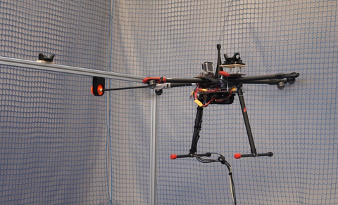 You can see the drone with a stick in contact flight.