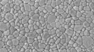 Scanning electron microscope image of an aluminum oxide surface. The microstructure shows lots of inidvidual grains smaller than one micrometer in diamater, that adjoin each other without any voids.