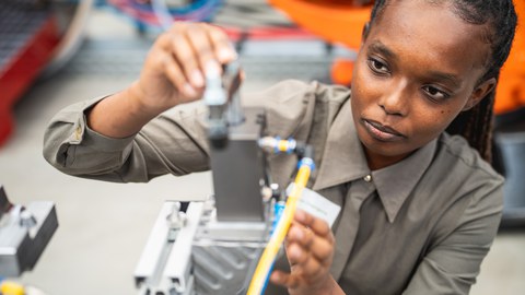 Close-up of a woman at a machine.