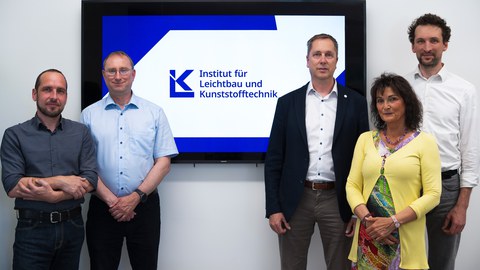 nstitute board (from left to right): PD Dr.-Ing. habil. Robert Kupfer, Dr.-Ing. Jörn Jaschinski, Institute Director Prof. Dr.-Ing. habil. Maik Gude, Dipl.-Ing. Barbara Röllig, Dr.-Ing. Sebastian Spitzer. In the center, the new ILK logo is displayed.