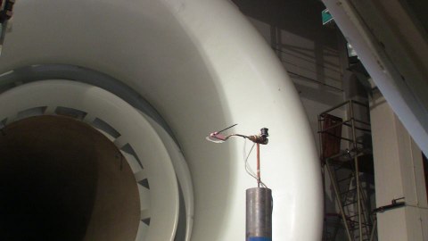 Cone-shaped probe during calibration in front of the collector in the large wind tunnel