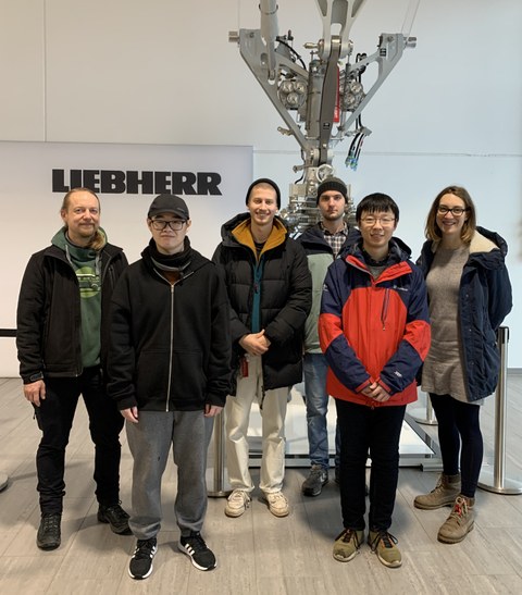 Excursion to Liebherr Aerospace Lindenberg with aircraft landing gear in the background