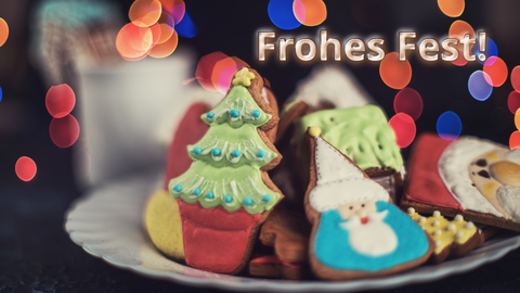 Auf dem Foto sind verschiedene Weihnachtsplätzchen und der Text "Frohes Fest" zu sehen.