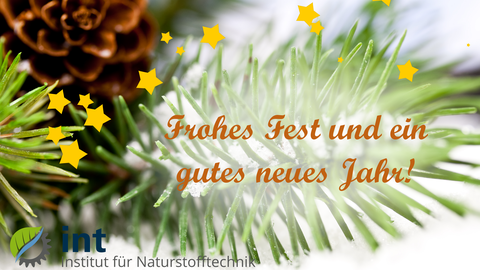 Nahaufnahme von verschneiten Tannenzweigen. Im Vordegrund gelbe Sterne und der Text "Frohes Fest und ein gutes neues Jahr!".