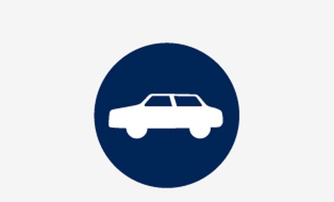 Grafik: ein weißes Symbolbild von einem Auto auf blauem runden Hintergrund
