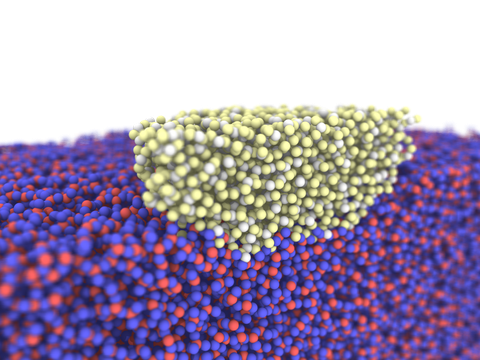 Auf dem Foto sieht man im unteren Bereich eine Vielzahl von blau-roten Kugeln, darüber mittig eine Vielzahl von gelb-weißen Kugeln. Sie symbolisieren einen Ausschnitt einer molekulardynamischen Simulation von amorphem Siliciumdioxid.