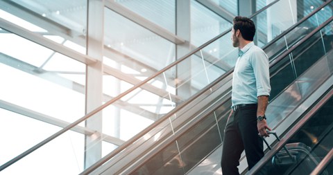 Man on an escalator