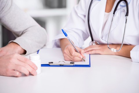 Doctor writing notes.