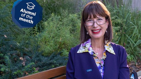 Photo of Luisa Giacoma on a park bench with plants in the background