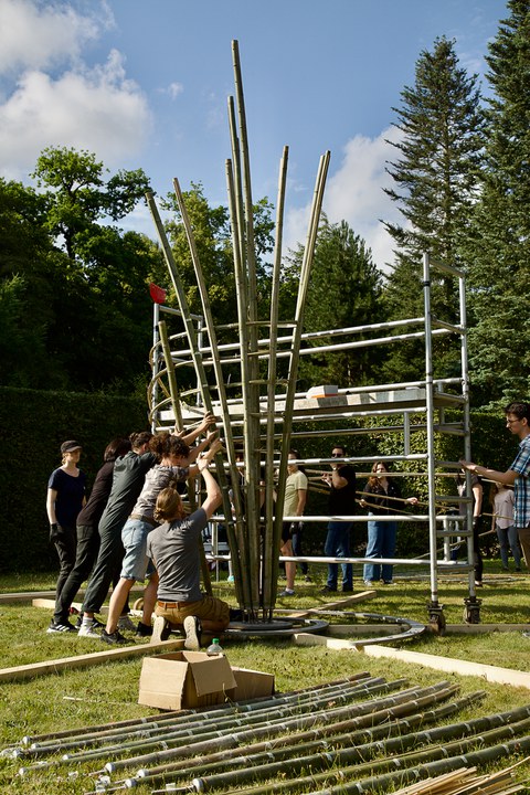 Students constructing the bamboo sculpture