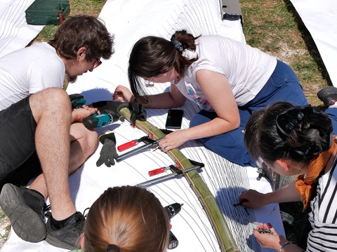 Students creating a large template for the sculpture
