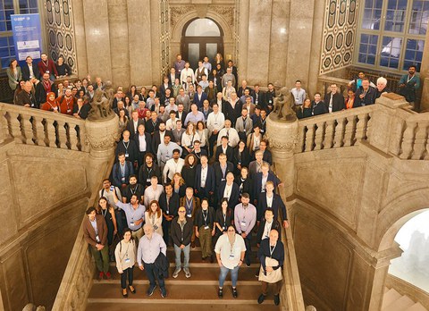 Group photo on a large staircase.