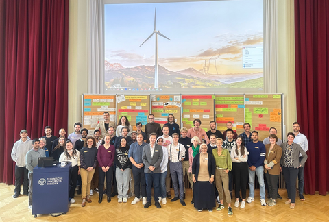 Group picture of international students on a stage.