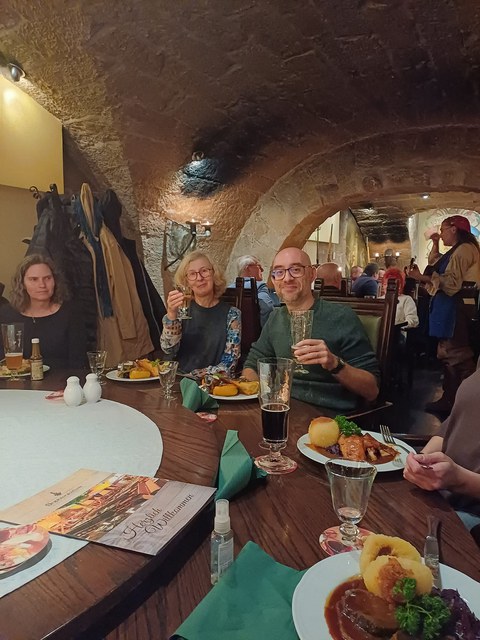 People at a table with Italian food.