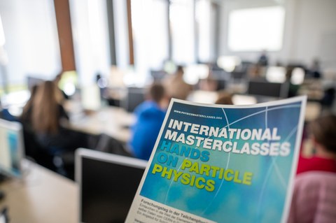information flyer of the masterclasses with lecture room in the background