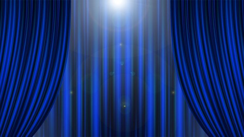 Das Foto zeigt einen doppelten Vorhang in dunkelblau. Der vordere Vorhang ist in der Mitte geöffnet, ein Licht ist zu erkennen.