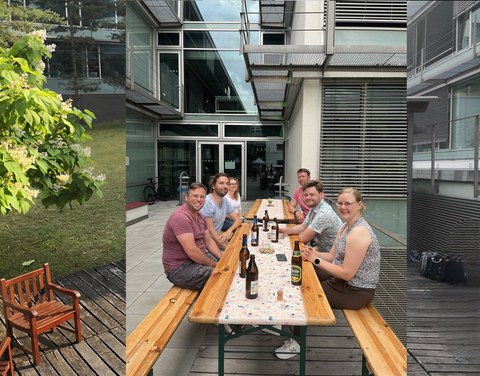 Das Foto zeigt Personen, die an einem Biertisch sitzen.