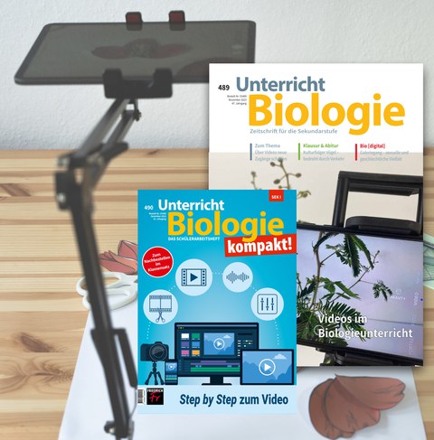 Tablet in einer Halterung und Zeitschriftencover