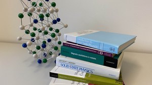 The photo shows books on condensed matter physics.