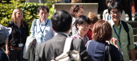 Japanese and German scientists in a sunny exchange outdoors