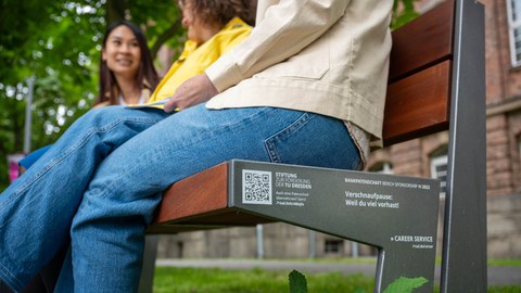 three people on a bench in the countryside with the inscription: Career Service: Take a breather - because you have a lot planned!