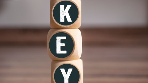 KEY Keep Educating Yourself on wooden background