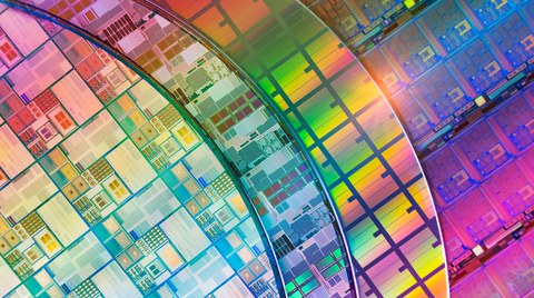 Silicon Wafers with microchips used in electronics for the fabrication of integrated circuits Silicon Wafers with microchips used in electronics for the fabrication of integrated circuits 