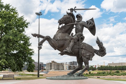 Statue of a knight with his sword outstretched, mounted on a horse