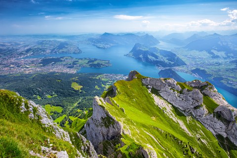 view of a vast mountain lake in the alps
