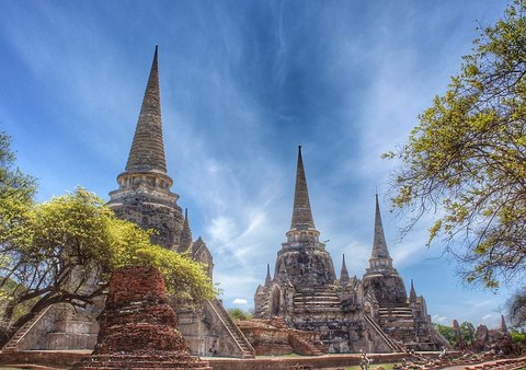 Ancient temple ruins with three tall cone-shaped spires