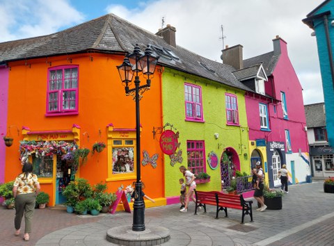 A front of little houses painted in very bright colours.