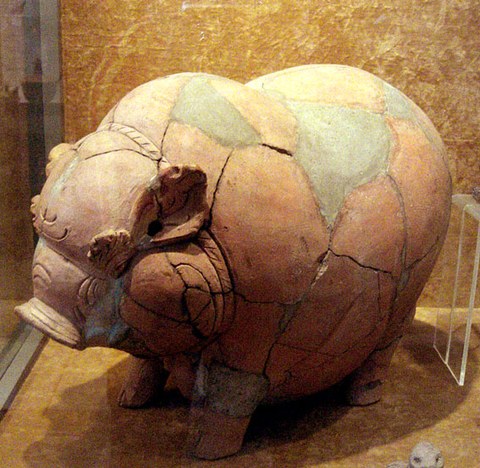 a reassembled terracotta piggy bank