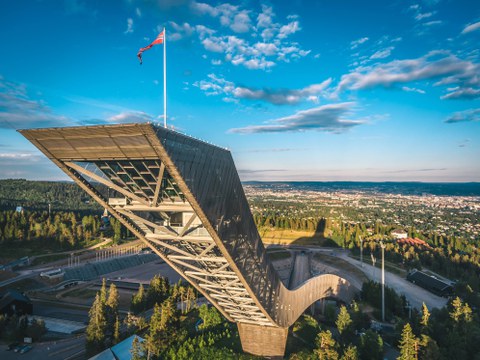 Ski-jumping platform shot from the air close to the height of where the jumps start. The perspective illustrates the extraordinary height.