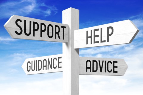 A signpost can be seen. It shows different directions labeled as "support", "guidance", "help" and "advice".