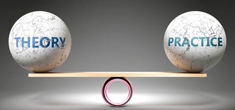 A picture of 2 balls labeled with "theory" and "practice" which are laying on a board which is placed on a pipe. The board is totally balanced.