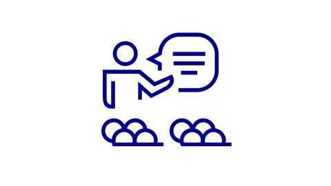 Icon mit Lehrperson und Sprechblase vor einer Gruppe