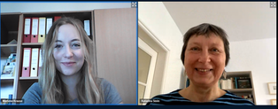 The screenshot shows a young woman and an older woman during a video conference. The two are each looking into their webcam.