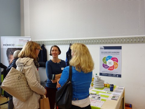 Colleagues in conversation with the environmental coordinator