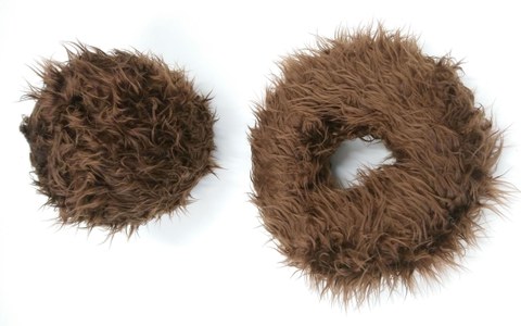 Brown, hairy donuts on white background