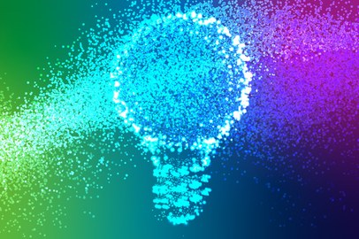 An illustration with a background gradient of blue, green, and violet. In the center, there is a light bulb made up of numerous small, glowing dots that flow from left to right, creating a sense of dynamic movement.