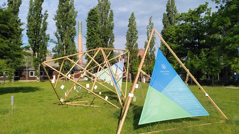 Installation presenting the Green Office with banner