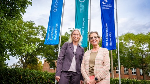 Members of TUD—including Rector Prof. Ursula Staudinger (right) and Marion Schmidt, Chief Communication Officer at TUD—celebrated the successful completion of the branding process in front of the Rectorate building at TU Dresden.