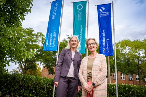 Members of TUD—including Rector Prof. Ursula Staudinger (right) and Marion Schmidt, Chief Communication Officer at TUD—celebrated the successful completion of the branding process in front of the Rectorate building at TU Dresden.