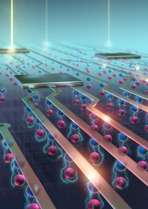 Vergrößertes Schema eines elektronischen Chips, man sieht auftreffendes Licht und unter den Leitbahnen rosa und blaue Kugeln übereinander.