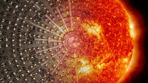 Darstellung einer glühenden Sonne vor dunklem Hintergrund, links im Bild lösen sich die Konturen auf.