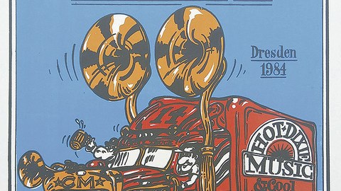 Auf dem Plakat des 14. Dixieland-Festivals ist ein gezeichneter, roter LKW mit der Aufschrift "Hot Dixie Music" zu sehen. Die beiden überdimensionierten Lautsprecher an der Fahrerkabine sowie die Fahrerkabine selbst sind im Goldton gehalten.
