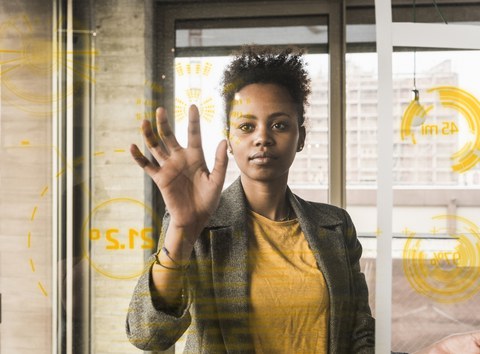 young woman working with touchscreen