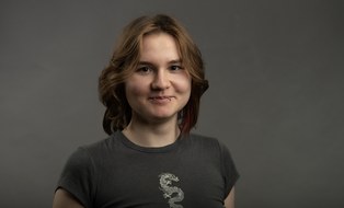 On display is a portrait photo of student employee Emely Nicht.