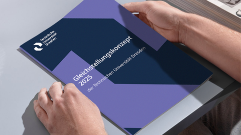 Two hands hold a booklet. The booklet is titled “2025 Equality Concept of TUD.”