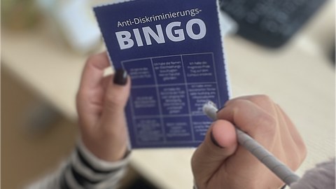  A Person holds the Courage-Bingo in its hands